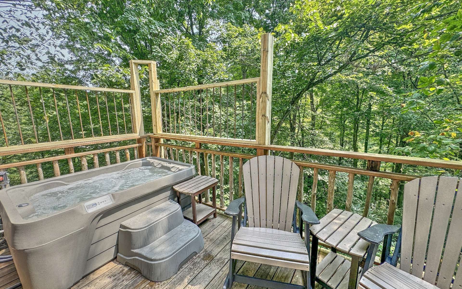 Pine Cove treehouse deck with hot tub